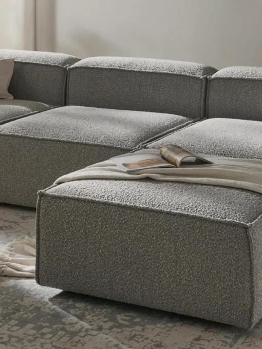 Modulares Sofa Lennon (4-Sitzer) aus Bouclé mit Hocker (links/rechts)